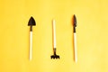 The tools, implements and farm or household equipment on yellow background. Top view. Space for text.