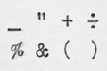 Real typewriter symbols on white paper