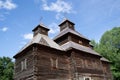 Authentic wooden Slavic Orthodox church against the sky and trees