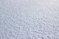 Real white snow surface. Background of fresh snow. Texture of blue snow sparkling in the sun Royalty Free Stock Photo