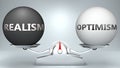Realism and optimism in balance - pictured as a scale and words Realism, optimism - to symbolize desired harmony between Realism Royalty Free Stock Photo
