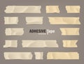 Realistic adhesive tape set. Sticky scotch, duct paper strips on brown background. Vector illustration. Royalty Free Stock Photo