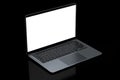 Realistic aluminum laptop with empty white screen isolated on black background. Royalty Free Stock Photo