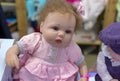 Realistic baby doll in the toy store