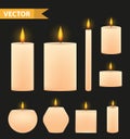 Realistic beige candles set. 3d burning candle collection. Isolated on a black background. Vector illustration. Royalty Free Stock Photo