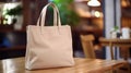 Realistic Beige Tote Canvas Fabric Bag Set-up In A Restaurant, Coffee Shop Interior, Tote Mock Up Blank. Beige Tote Bag Template