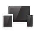 Realistic black, silvery tablets and a black mobile phone with light on black screens Royalty Free Stock Photo