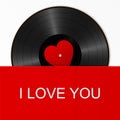 Realistic Black Vinyl Record with red heart label in a bright cover with text I love you. Retro Sound Carrier on white background Royalty Free Stock Photo