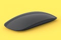 Realistic black wireless computer mouse with touch isolated on yellow background Royalty Free Stock Photo