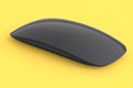 Realistic black wireless computer mouse with touch isolated on yellow background Royalty Free Stock Photo