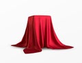 Realistic box covered with red silk cloth. Isolated on white background. Satin fabric wave texture material. Textile Royalty Free Stock Photo