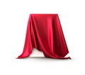 Realistic box covered with red silk cloth. Isolated on white background. Satin fabric wave texture material. Textile