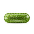 Realistic capsule pill with green granules inside it.