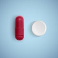 Realistic capsule and a pill on a white background, medicine, red capsule and white tablet, vector illustration Royalty Free Stock Photo