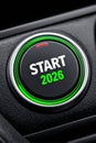 Realistic car engine start button featuring vibrant green accents, showcasing modern automotive technology and design Royalty Free Stock Photo