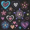 Realistic Chalk Drawn Sketch. Set of Design Elements Colorful Hearts and Flowers Isolated on Dark Chalkboard Backdrop Royalty Free Stock Photo