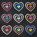 Realistic Chalk Drawn Sketch. Set of Design Elements Colorful Hearts Isolated on Chalkboard Backdrop