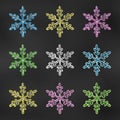 Realistic Chalk Drawn Sketch. Set of Design Elements Colorful Snowflakes Isolated on Chalkboard Backdrop