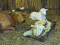 Realistic christmas nativity scene with figurines including Jesus and animals Royalty Free Stock Photo