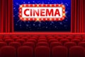 Realistic cinema hall interior with red seats. Retro style cinema sign with spot light frame. Movie premiere poster Royalty Free Stock Photo