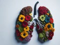 Realistic colorful lungs made of fresh flowers on white background. ai generative