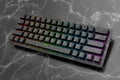 Realistic computer keyboard with black marble texture isolated on dark