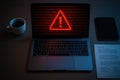 Realistic Cybersecurity Workspace with Red Alert on Laptop Royalty Free Stock Photo
