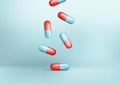 Realistic 3d glossy falling pill capsules. Cartoon 3d cylinder blue and red tablet icon, pharmaceutical capsule, pill icon,