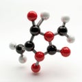 Realistic 3D model of vitamin C molecule structure with black carbon atoms red oxygen and white hydrogen spheres connected by Royalty Free Stock Photo