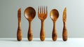 A realistic 3D modern illustration showing wooden cutlery, disposable fork, spoon, and knife isolated on a white Royalty Free Stock Photo