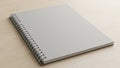Blank Spiral Notebook Mockup on Wooden Surface Royalty Free Stock Photo