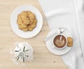 Realistic 3D rendering of a pile of cookies on a white plate with a delicious latte in a white cup