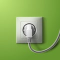 Realistic electric white socket and plug on green