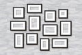 Realistic Empty Wall Photo Frames collage. Vector black picture frame set mockup template with shadow on white wooden Royalty Free Stock Photo