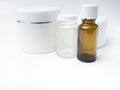 Realistic essential oil brown bottle and white containers Mock up bottle. Cosmetic vial, flask, flacon. Medical bank