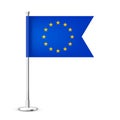 Realistic European table flag on a chrome steel pole. Souvenir from Europe. Desk flag made of paper or fabric and shiny