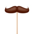 Realistic fake mustache on a wooden stick. Vintage paper mustache for carnival or holiday. Brown facial hair, hipster