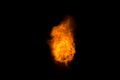 Realistic fiery explosion over a black background