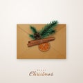 Realistic flat lay composition with an post envelopment, fir tree branches, cinnamon, orange slice and pine cone.