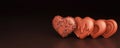 Realistic Four Heart Shaped Chocolates On Dark Brown Background. 3D