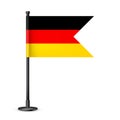 Realistic German table flag on a black steel pole. Souvenir from Germany. Desk flag made of paper or fabric and shiny