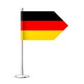 Realistic German table flag on a chrome steel pole. Souvenir from Germany. Desk flag made of paper or fabric and shiny