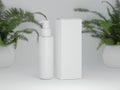 Glossy dispenser bottle with packaging box on a white background with fern plants Royalty Free Stock Photo