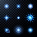 Realistic glow light effects. Lens flare set. Realistic glowing sparkles particles effects on dark transparent grid Royalty Free Stock Photo