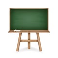 Realistic green chalkboard with wooden frame holder and pieces of chalk. Rubbed out chalkboard with clean green space Royalty Free Stock Photo