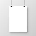 Realistic hanging blank paper sheet with shadow in A4 format and black paper clip, binder on gray background. Design Royalty Free Stock Photo
