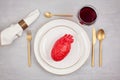 Realistic heart on the dining table in the plate