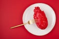 Realistic heart on the dining table in the plate