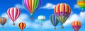 Realistic hot air balloons in sky. Background with blue cloudy heaven and aerostats. Colorful dome and baskets. Flying Royalty Free Stock Photo