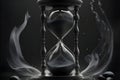 Realistic hour glass in dark and smoky background Royalty Free Stock Photo